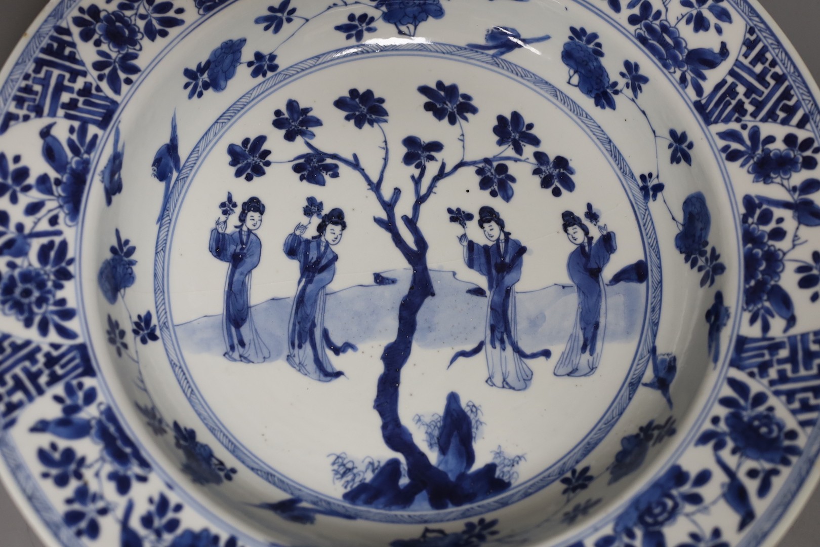 A Chinese blue and white ‘ladies’ basin, Kangxi period, cracked 34cm